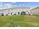 Spacious backyard with a well-maintained lawn and a covered patio at 13323 Savaine St, Charlotte, NC 28278