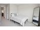 Cozy bedroom with a comfortable bed, soft lighting, and a full-length mirror at 13323 Savaine St, Charlotte, NC 28278