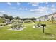 Community park featuring picnic tables, grills, and plenty of green space at 13323 Savaine St, Charlotte, NC 28278