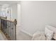 Hallway overlooking staircase with carpet and iron rail at 13323 Savaine St, Charlotte, NC 28278