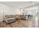 Cozy living room with hardwood floors and open access to the kitchen and dining area at 13323 Savaine St, Charlotte, NC 28278