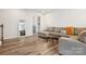Open living space with hardwood floors and view of entryway and stairway at 13323 Savaine St, Charlotte, NC 28278