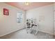 Stylish home office with modern desk, ergonomic chair, natural light, and charming decor at 13323 Savaine St, Charlotte, NC 28278