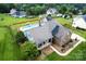 Aerial view of a lovely home with a pool and fenced yard at 13733 Castleford Dr, Mint Hill, NC 28227