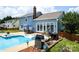 An amazing backyard with inground pool, patio and outdoor kitchen at 13733 Castleford Dr, Mint Hill, NC 28227