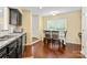 Sunlit breakfast nook features hardwood floors and a window view at 13733 Castleford Dr, Mint Hill, NC 28227