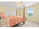 Main bedroom showcases a four-poster bed, neutral carpet, and a window at 13733 Castleford Dr, Mint Hill, NC 28227