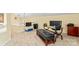 Functional home office space with a glass desk and comfortable seating at 13733 Castleford Dr, Mint Hill, NC 28227