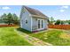 Backyard outbuilding with French doors and walkway at 13733 Castleford Dr, Mint Hill, NC 28227
