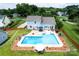 Aerial view of home with large pool, hot tub, patio area, and well-manicured lawn at 13733 Castleford Dr, Mint Hill, NC 28227