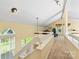 Bright upper hallway offering natural light and views to the study at 13733 Castleford Dr, Mint Hill, NC 28227
