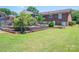 Lovely backyard featuring a lush lawn and garden beds for a serene outdoor experience at 1553 Home Trl # 51, Lincolnton, NC 28092