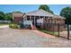 Inviting backyard features covered porch and patio for relaxing and entertaining at 1553 Home Trl # 51, Lincolnton, NC 28092