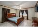 Bright bedroom with a queen bed, tile floors, and natural light at 1553 Home Trl # 51, Lincolnton, NC 28092