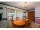 Dining room features wood table, matching chairs, and window that provides natural light at 1553 Home Trl # 51, Lincolnton, NC 28092