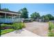 Landscaped backyard with brick pathway that leads to a charming detached structure and additional building at 1553 Home Trl # 51, Lincolnton, NC 28092