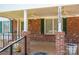 Inviting front porch with ceiling fans, brick columns, and ample space for outdoor seating at 1553 Home Trl # 51, Lincolnton, NC 28092