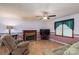 Warm and inviting living room featuring a fireplace and large window for natural light at 1553 Home Trl # 51, Lincolnton, NC 28092