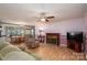 Cozy living room featuring a fireplace, ceiling fan, and comfortable seating arrangement at 1553 Home Trl # 51, Lincolnton, NC 28092
