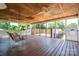 Covered porch with wood flooring, ceiling fans, and swing, perfect for outdoor relaxation at 1553 Home Trl # 51, Lincolnton, NC 28092