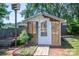 Cozy shed surrounded by garden beds with a small access ramp at 1553 Home Trl # 51, Lincolnton, NC 28092