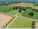Spacious lot with trees, a home, and farm land surrounding it with long driveway at 1904 Old Peachland Rd, Marshville, NC 28103
