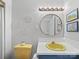 Bright bathroom featuring a unique yellow sink and toilet plus round mirror at 1904 Old Peachland Rd, Marshville, NC 28103