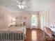 Well-lit bedroom with a ceiling fan, closet, hardwood floors and natural light at 1904 Old Peachland Rd, Marshville, NC 28103