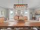 Elegant dining room with long wooden table, neutral chairs, and decorative centerpiece at 1904 Old Peachland Rd, Marshville, NC 28103