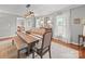 Bright dining room with a wooden table, bench seating, and classic window views at 1904 Old Peachland Rd, Marshville, NC 28103