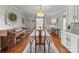 Open dining room features a piano, table set for dinner, and is filled with light at 1904 Old Peachland Rd, Marshville, NC 28103