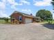 The exterior of this lovely home features an attached garage and a well-maintained lawn at 1904 Old Peachland Rd, Marshville, NC 28103