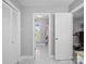 Bright hallway leading to bathroom and bedroom with tile flooring at 1904 Old Peachland Rd, Marshville, NC 28103