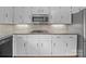Updated kitchen with white cabinetry, a gas range, and sleek countertops for cooking at 1904 Old Peachland Rd, Marshville, NC 28103
