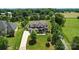 A sprawling home is set on a manicured lot with mature trees at 200 Squash Harvest Ct, Matthews, NC 28104