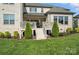 Expansive backyard view featuring a tiered deck with stairs leading to a lush green lawn at 200 Squash Harvest Ct, Matthews, NC 28104
