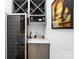 Wet bar area featuring a wine fridge, bar cabinet and wine storage at 200 Squash Harvest Ct, Matthews, NC 28104