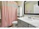 Traditional bathroom featuring a single vanity, a toilet and a pink shower curtain at 200 Squash Harvest Ct, Matthews, NC 28104