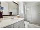 Clean bathroom showcases a glass-enclosed shower, toilet, and stylish gray vanity at 200 Squash Harvest Ct, Matthews, NC 28104