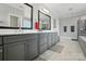 Elegant primary bathroom with dual vanity, bath, and shower at 200 Squash Harvest Ct, Matthews, NC 28104