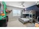 bedroom with a bunk bed, desk, ceiling fan, and playful decor at 200 Squash Harvest Ct, Matthews, NC 28104