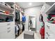 Spacious walk-in closet with ample shelving and storage solutions, including a dressing area with mirror at 200 Squash Harvest Ct, Matthews, NC 28104