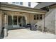 Inviting covered deck with stylish furniture and easy access to the interior, perfect for outdoor relaxation at 200 Squash Harvest Ct, Matthews, NC 28104