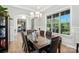 Bright dining room with grand window, a table with seating for eight at 200 Squash Harvest Ct, Matthews, NC 28104