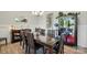 A modern dining area with large dining table and a cabinet for storing dishes at 200 Squash Harvest Ct, Matthews, NC 28104