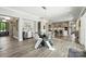 Open concept dining area featuring modern table, chairs, and stylish light fixture at 200 Squash Harvest Ct, Matthews, NC 28104