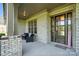 Inviting covered porch with brick pillars and stylish seating welcomes visitors at 200 Squash Harvest Ct, Matthews, NC 28104