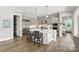 Kitchen featuring a large island, stainless appliances and custom cabinets at 200 Squash Harvest Ct, Matthews, NC 28104