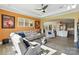 Open living room with modern furnishings and hardwood floors leading into a well-equipped kitchen at 200 Squash Harvest Ct, Matthews, NC 28104