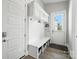 Practical mudroom area with a bench, storage cubbies, and hooks for organization near the entrance at 200 Squash Harvest Ct, Matthews, NC 28104